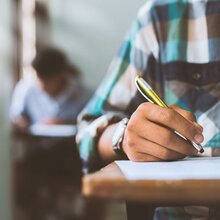 Students at desks taking tests