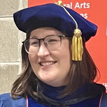 Head shot of Amanda East in her graduation cap and gown.