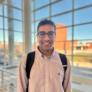 Portrait of Stephen Kocheril in the atrium of the CLSL building on the UIUC campus.