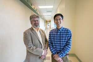 Jonathan Sweedler stands next to Fan Lam in a hallway on the Illinois campus.