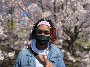 Portrait of Robert in front of blooming trees on the grounds of Japan house on the UIUC campus.