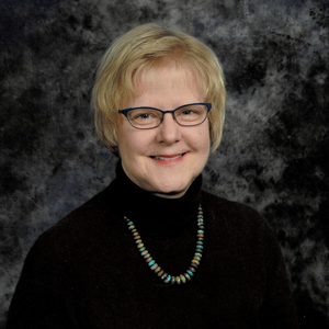 Portrait of Sandra Murawski on a dark background